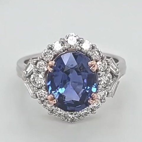 3.6 carat oval Ceylon sapphire ring with diamond halo