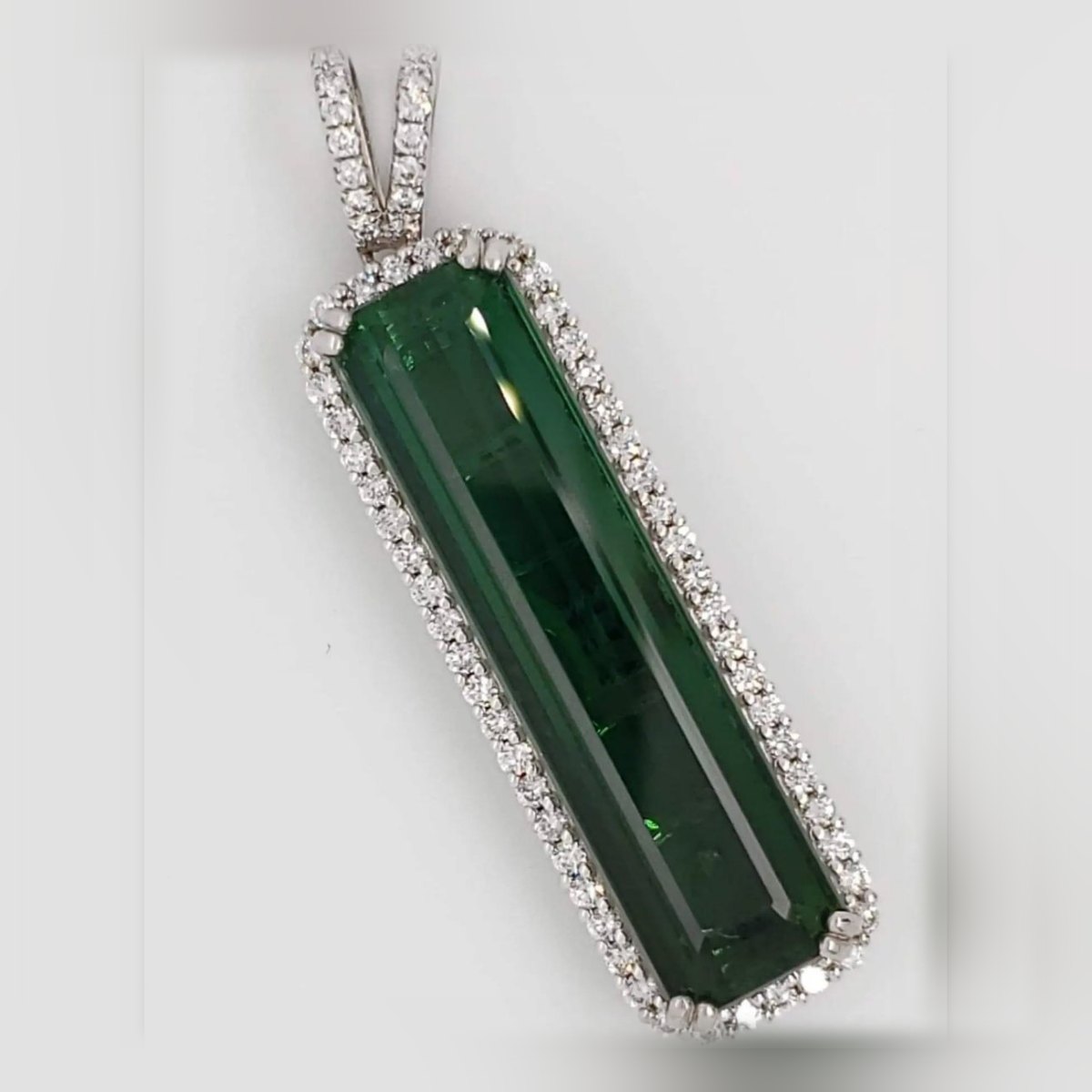 21 carat chrome green tourmaline pendant framed in diamonds