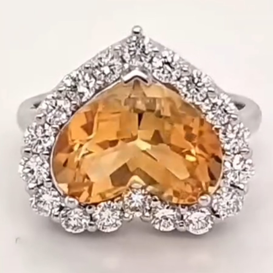 Heart-shaped citrine ring with a diamond halo in white gold, custom made by Marc Merritt