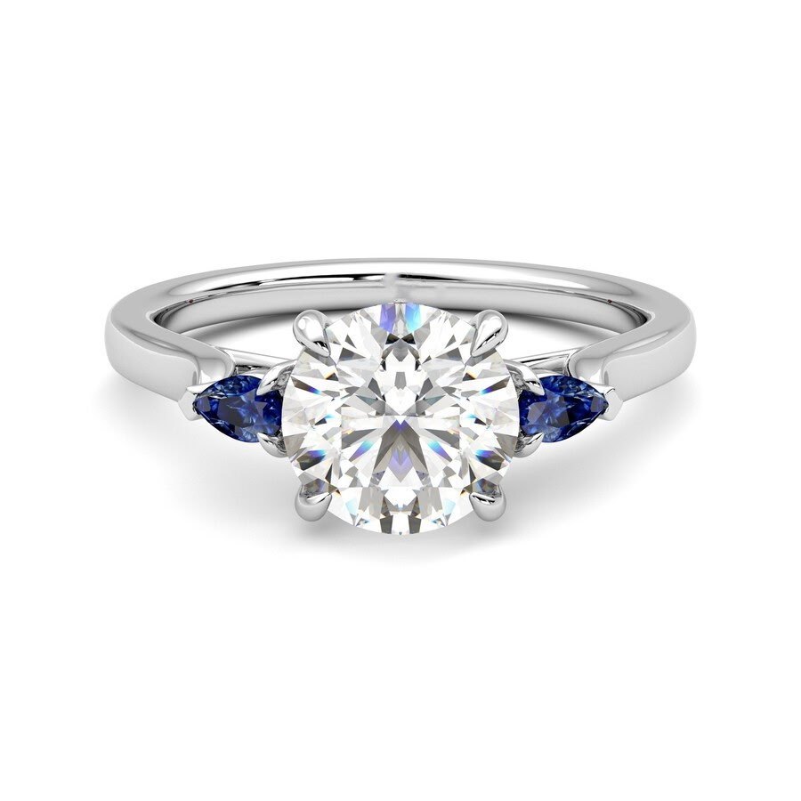 2.5ct GIA round brilliant diamond engagement ring with pear-shaped blue sapphire accents in platinum