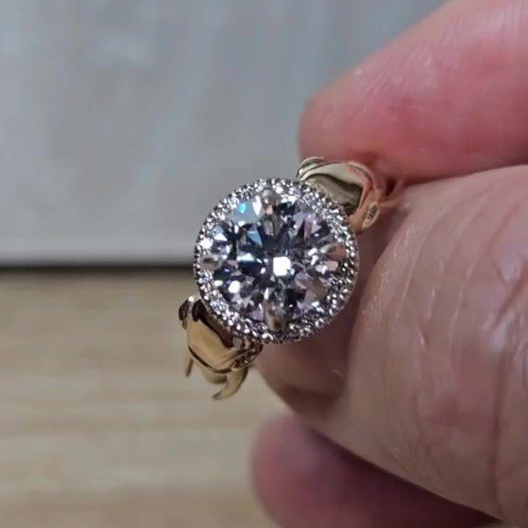 Custom elephant engagement ring, face view of the diamond halo