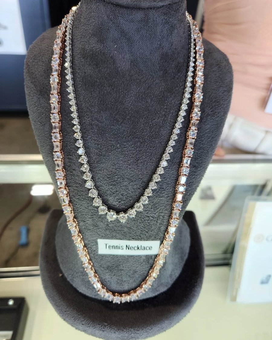 Diamond tennis and Riviera necklaces on display