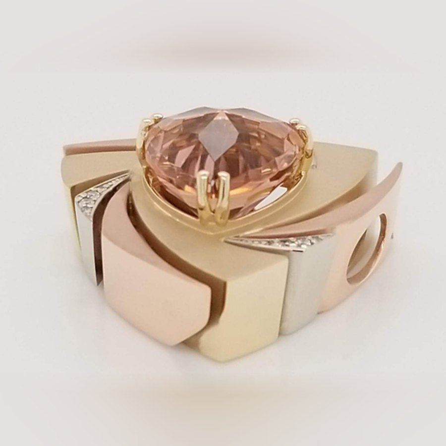 Tri-color gold pendant with a 7.93 carat flawless trillion-cut Nigerian pink tourmaline by Mark Gronlund and diamond accents