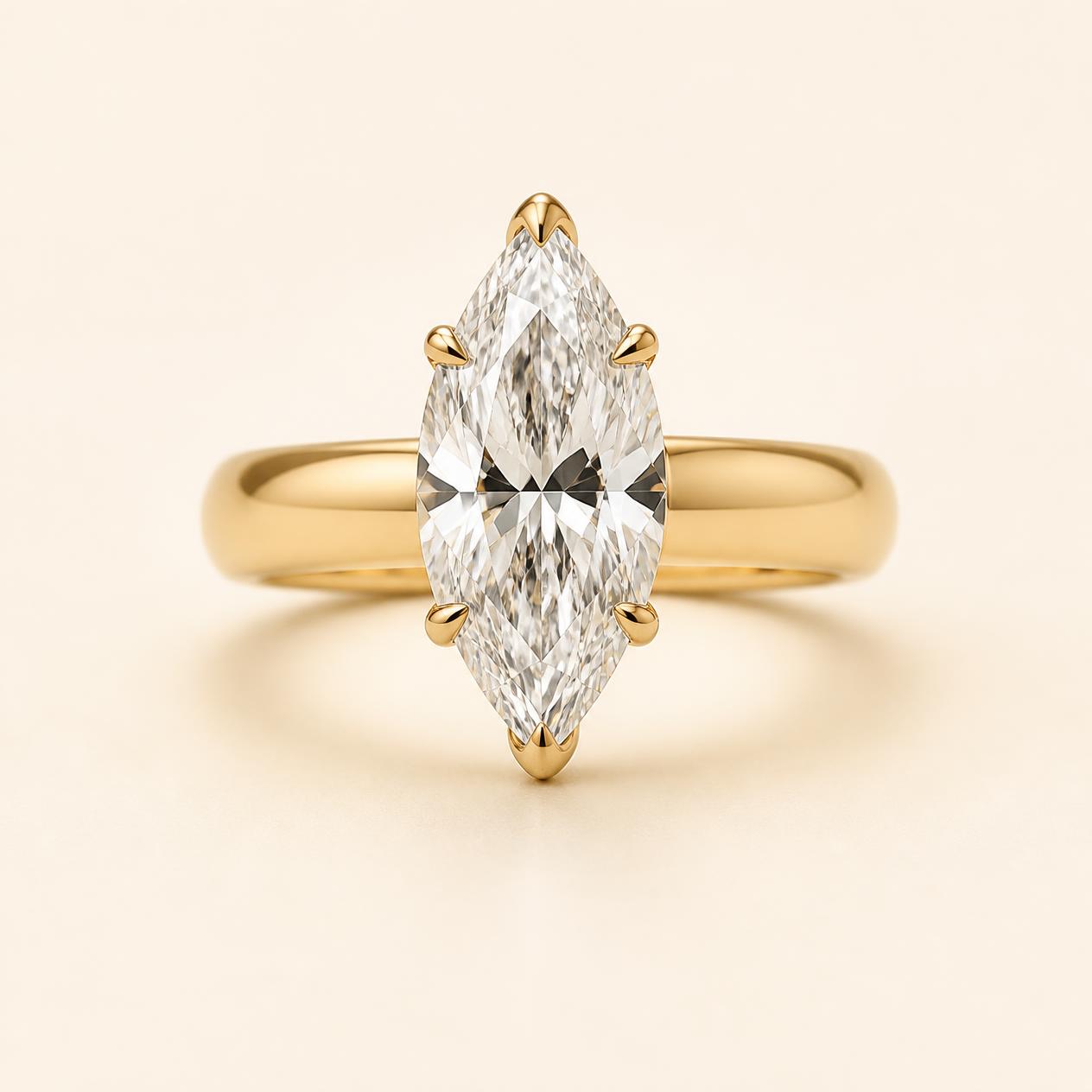 Marquise diamond solitaire on a substantial yellow gold band