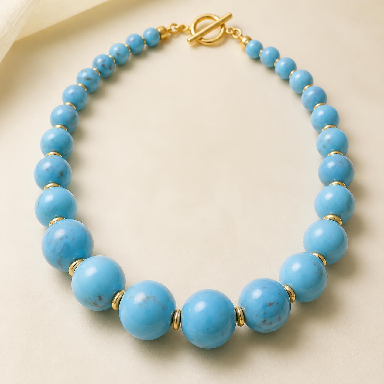 Graduated turquoise bead necklace with gold rondelles and toggle clasp
